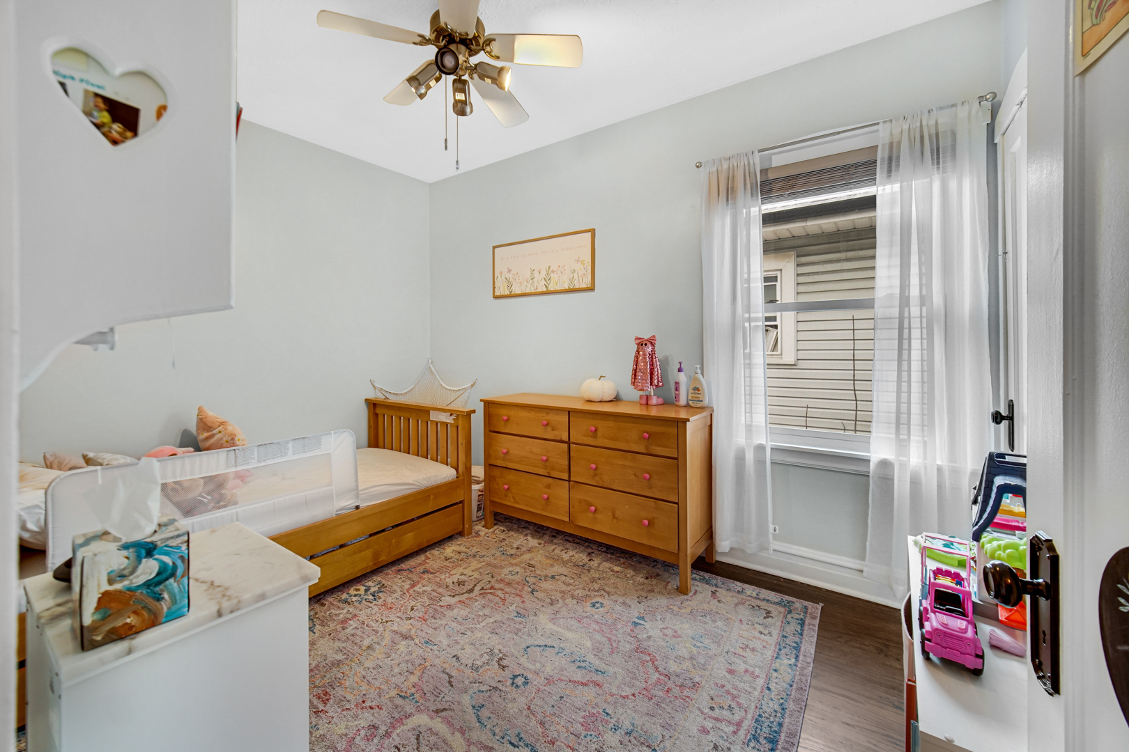 5531 West Grace Street Chicago, IL 60641 - Photo 15 of 22 a bedroom with furniture and a window