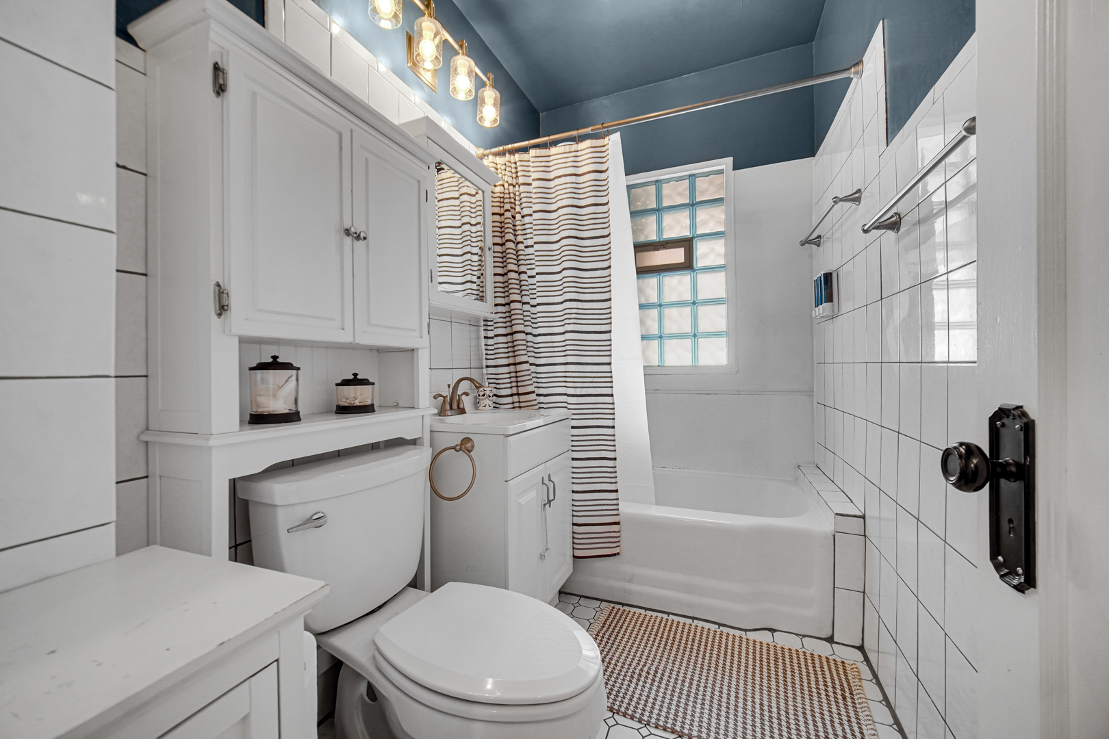 5531 West Grace Street Chicago, IL 60641 - Photo 16 of 22 a bathroom with a sink toilet and shower