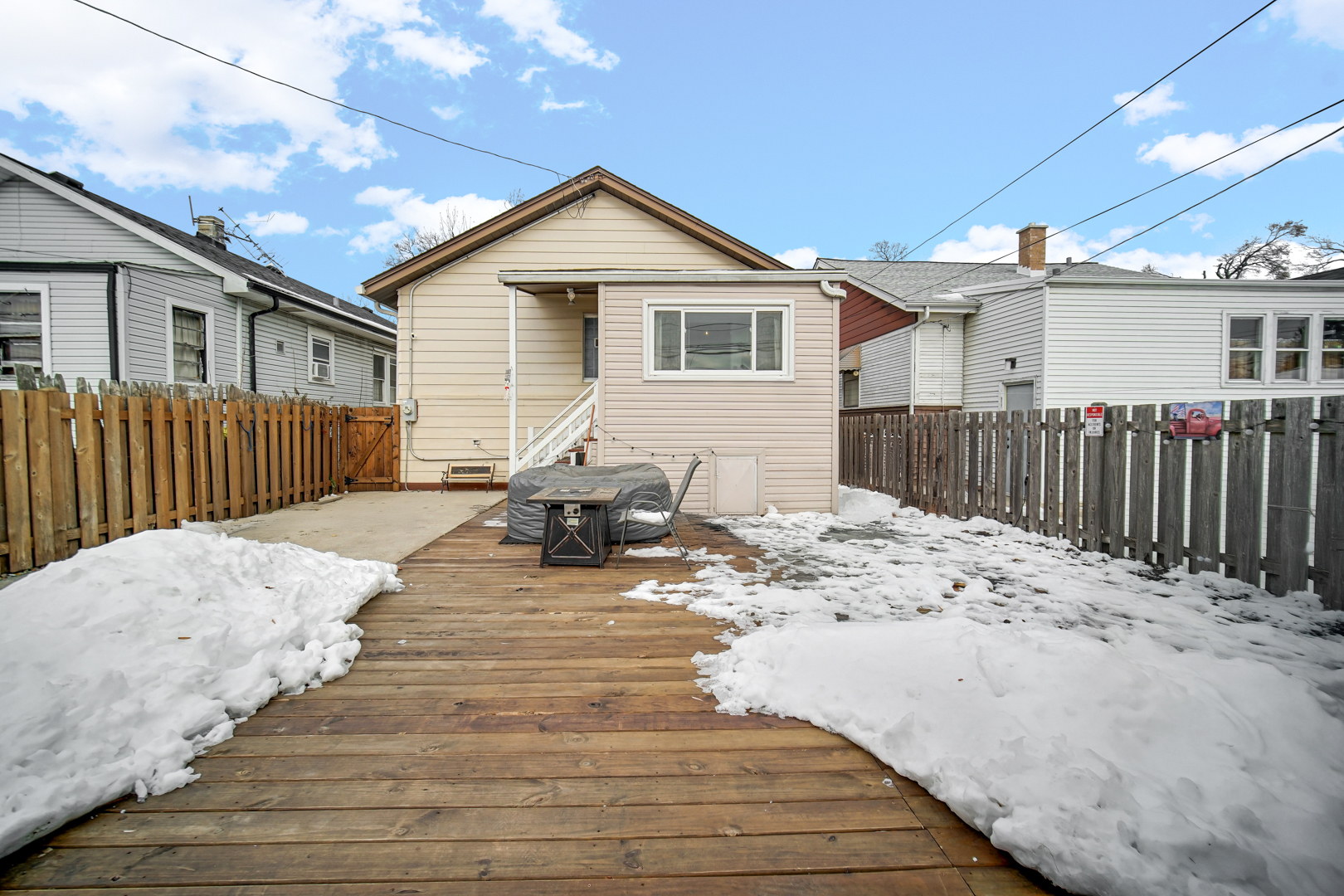 5531 West Grace Street Chicago, IL 60641 - Photo 6 of 22 a view of a house with wooden fence