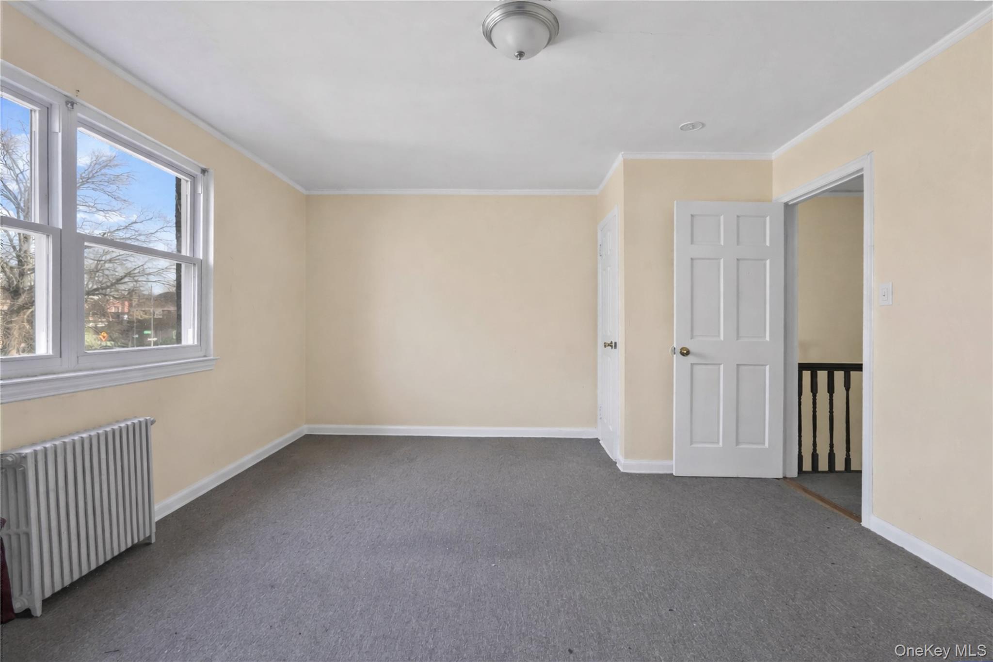 136-76 71st Road Queens, NY 11367 - Photo 15 of 31 a view of an empty room with a window