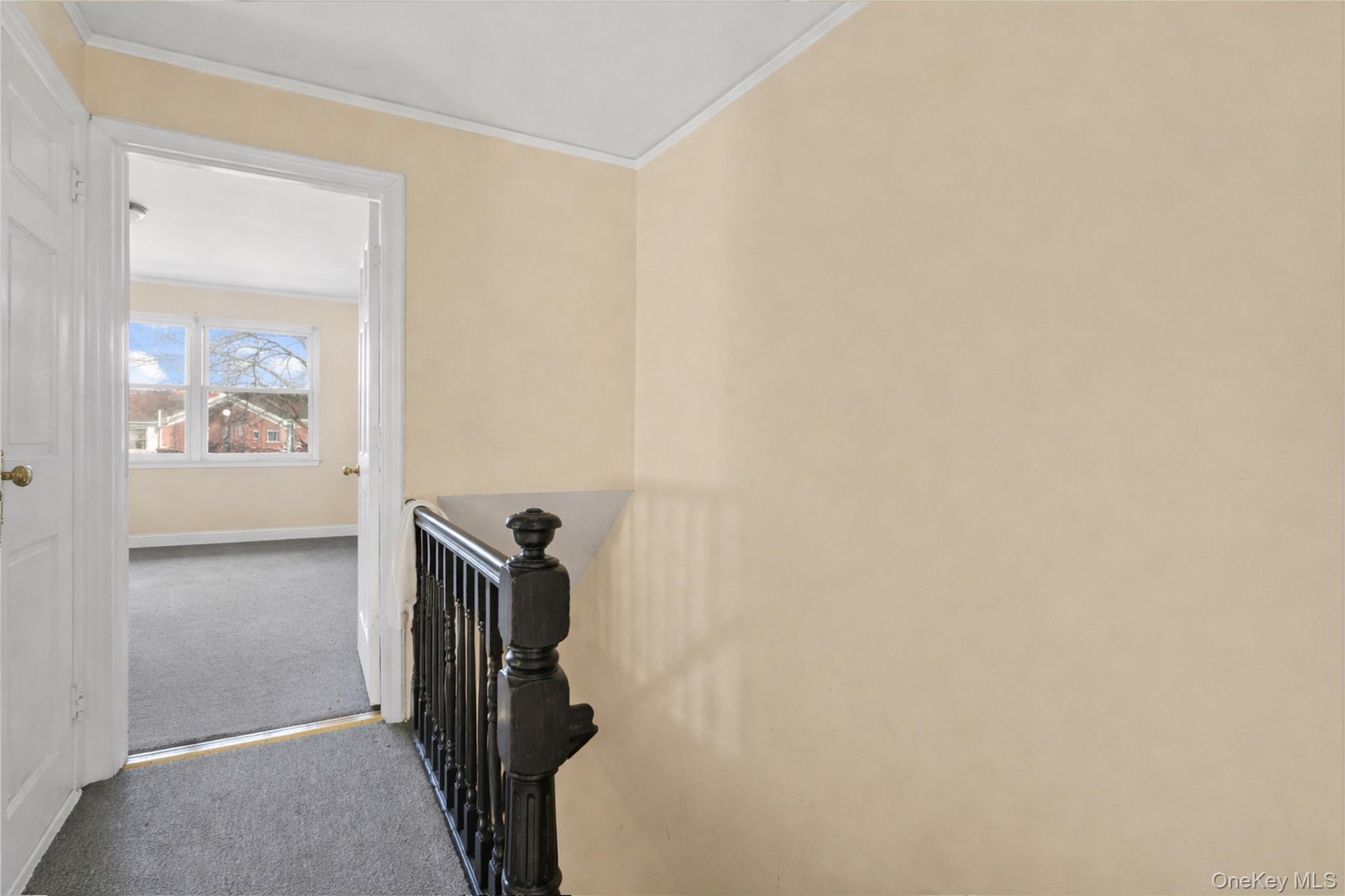 136-76 71st Road Queens, NY 11367 - Photo 20 of 31 a view of a livingroom with a white wall and a refrigerator