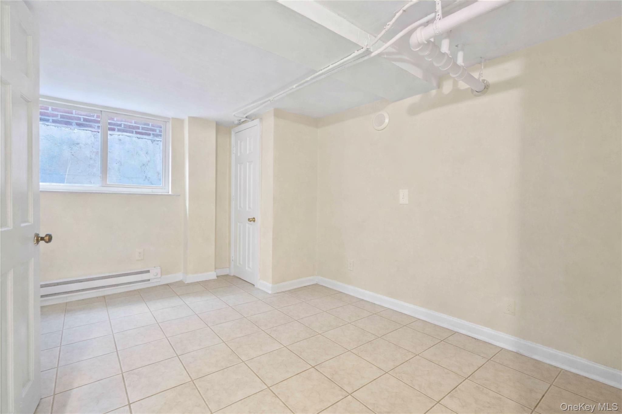 136-76 71st Road Queens, NY 11367 - Photo 23 of 31 a view of an empty room