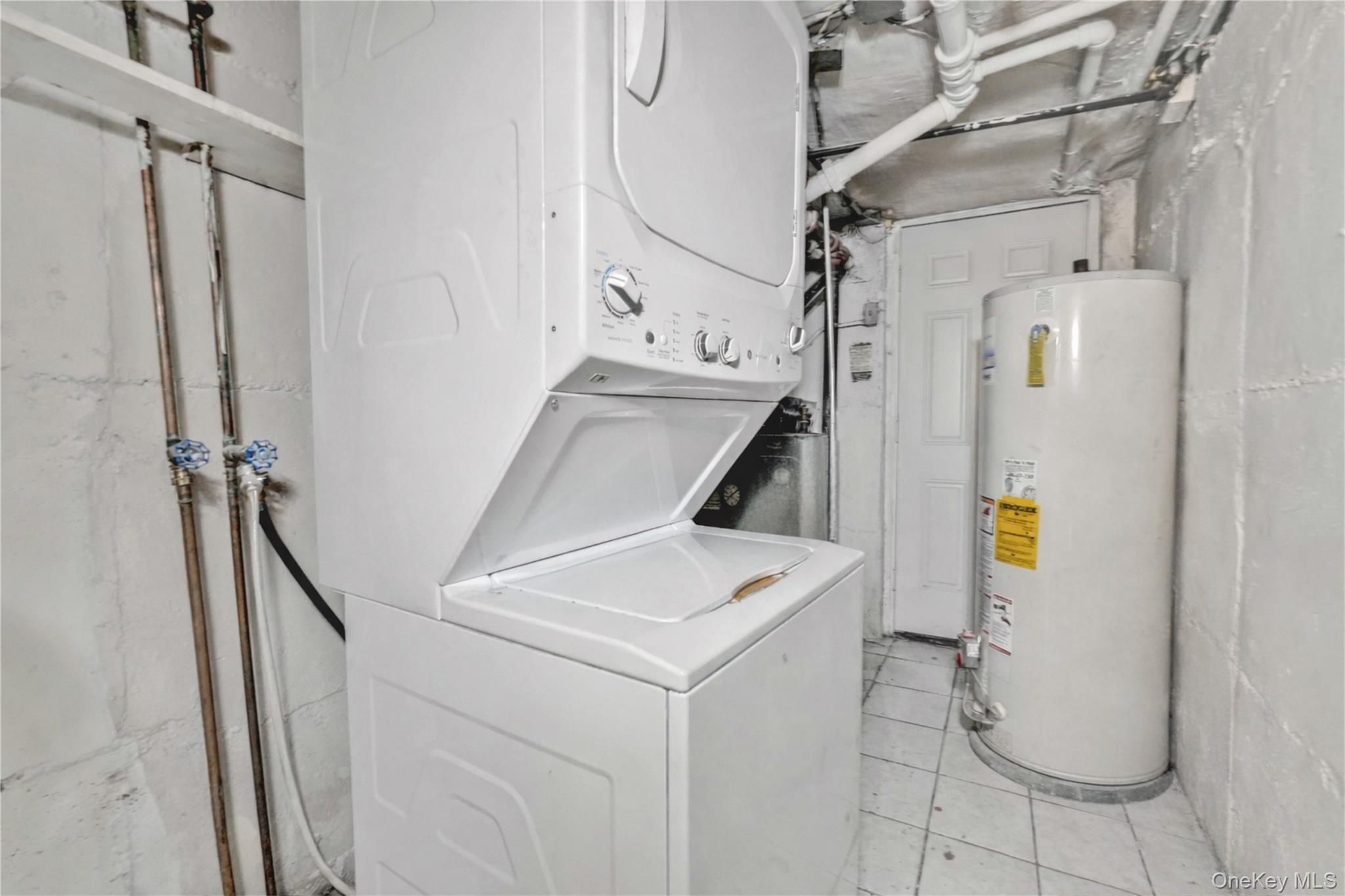 136-76 71st Road Queens, NY 11367 - Photo 30 of 31 a utility room with dryer and washer