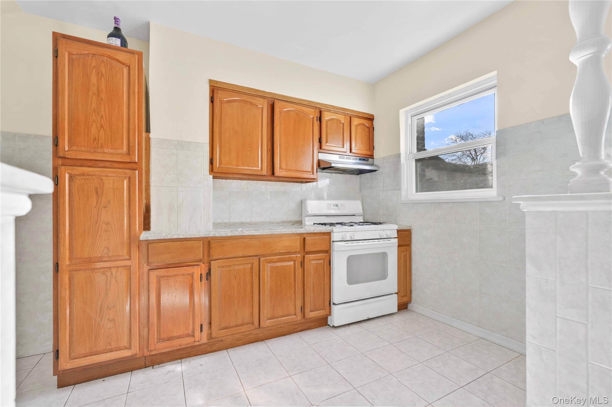136-76 71st Road Queens, NY 11367 - Photo 5 of 31 a kitchen with stainless steel appliances granite countertop a refrigerator and a sink