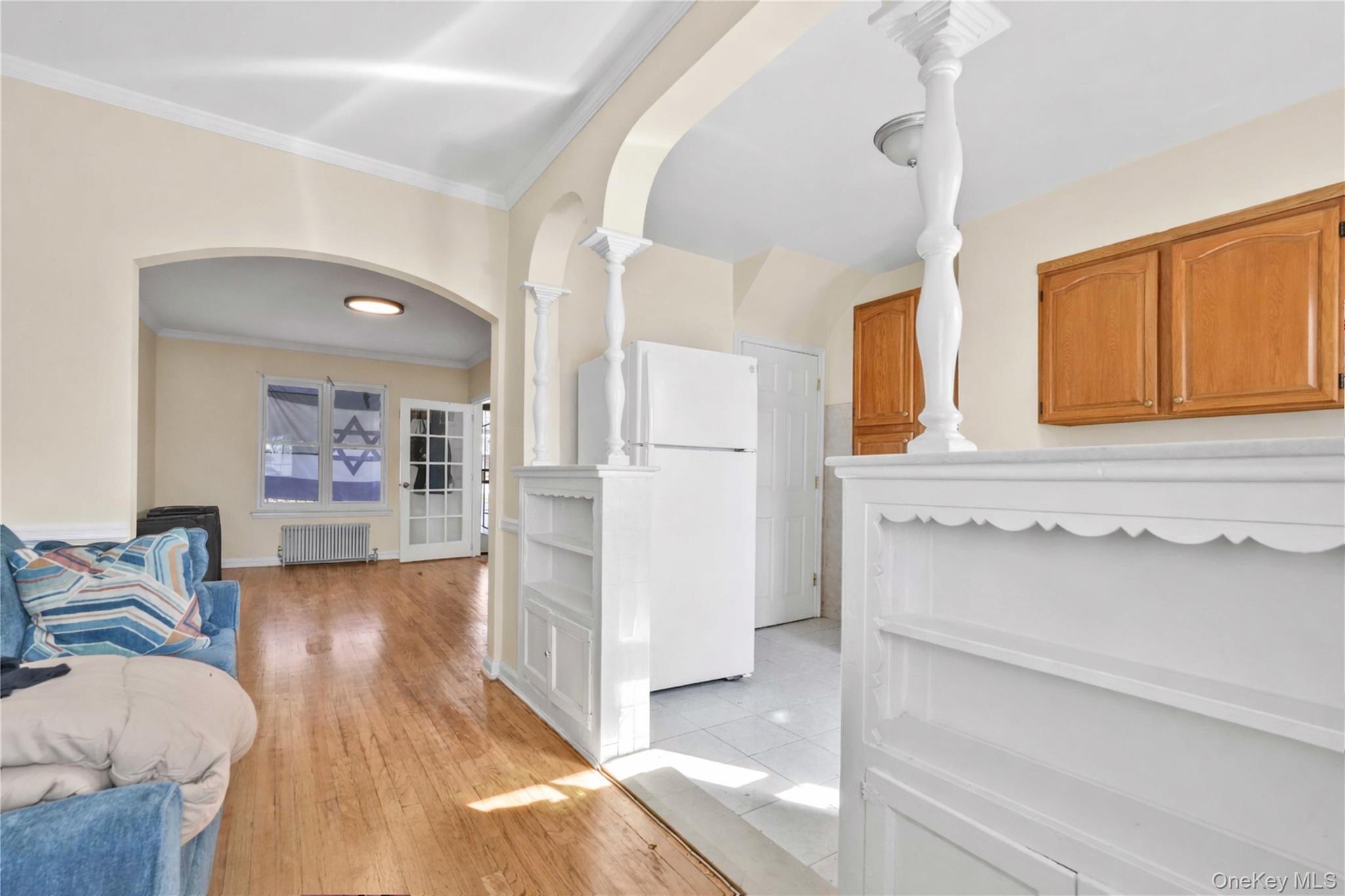 136-76 71st Road Queens, NY 11367 - Photo 8 of 31 a view of hallway with furniture and wooden floor
