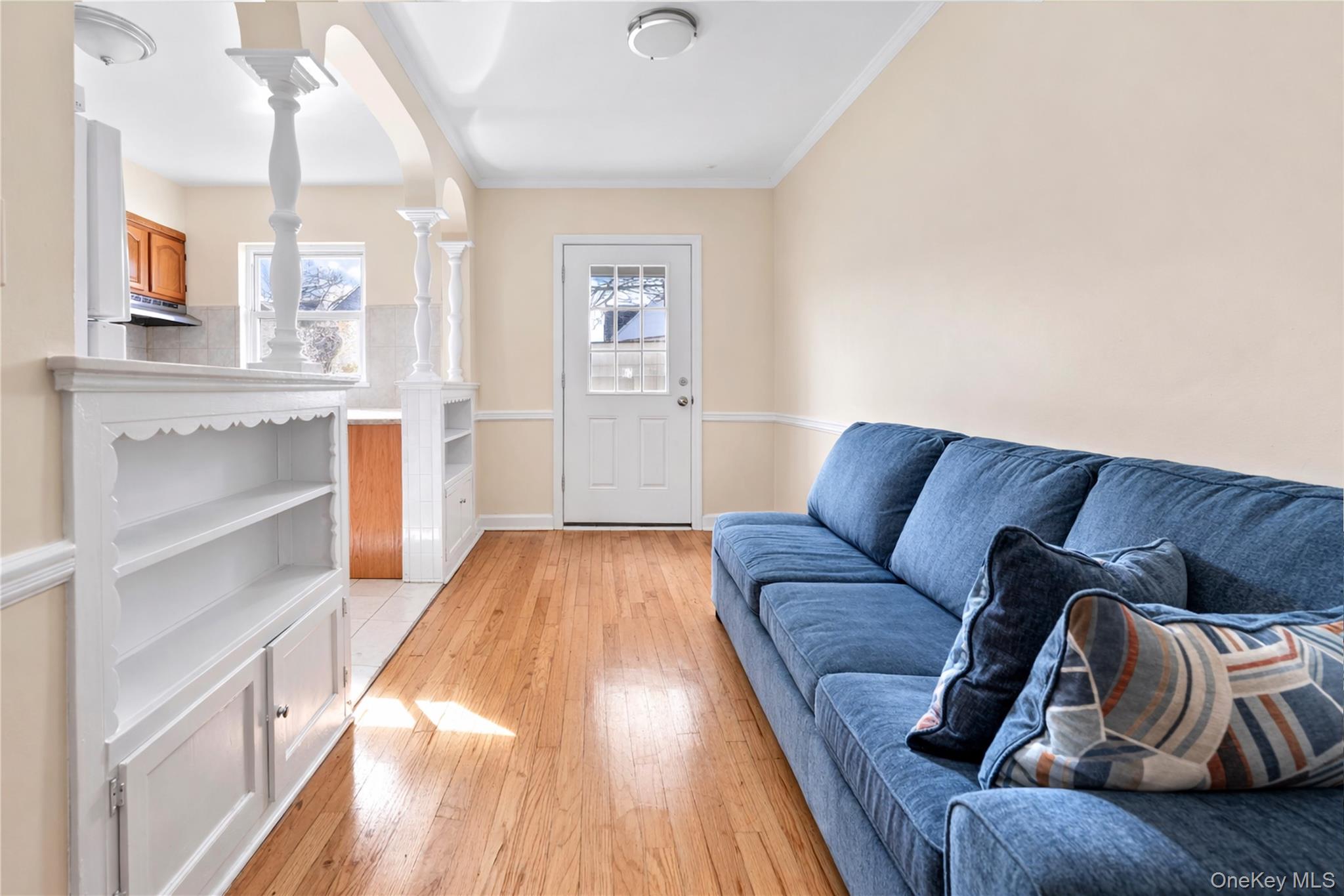 136-76 71st Road Queens, NY 11367 - Photo 9 of 31 a living room with furniture and a wooden floor