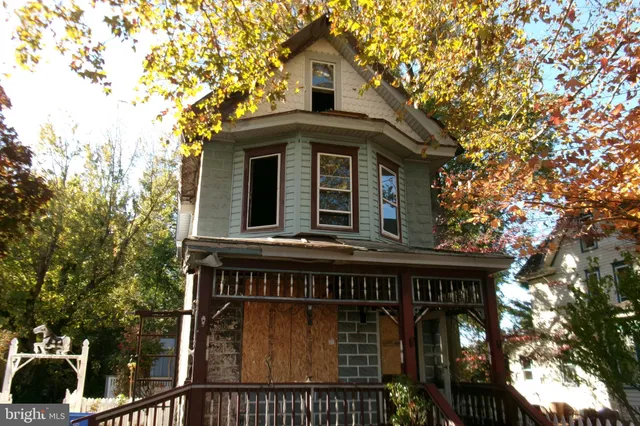 a front view of a house with yard