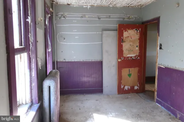 a view of front door with cabinets