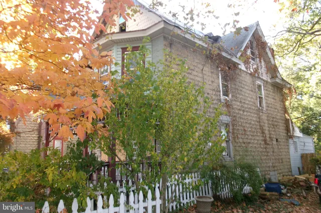 a view of a large building with a tree