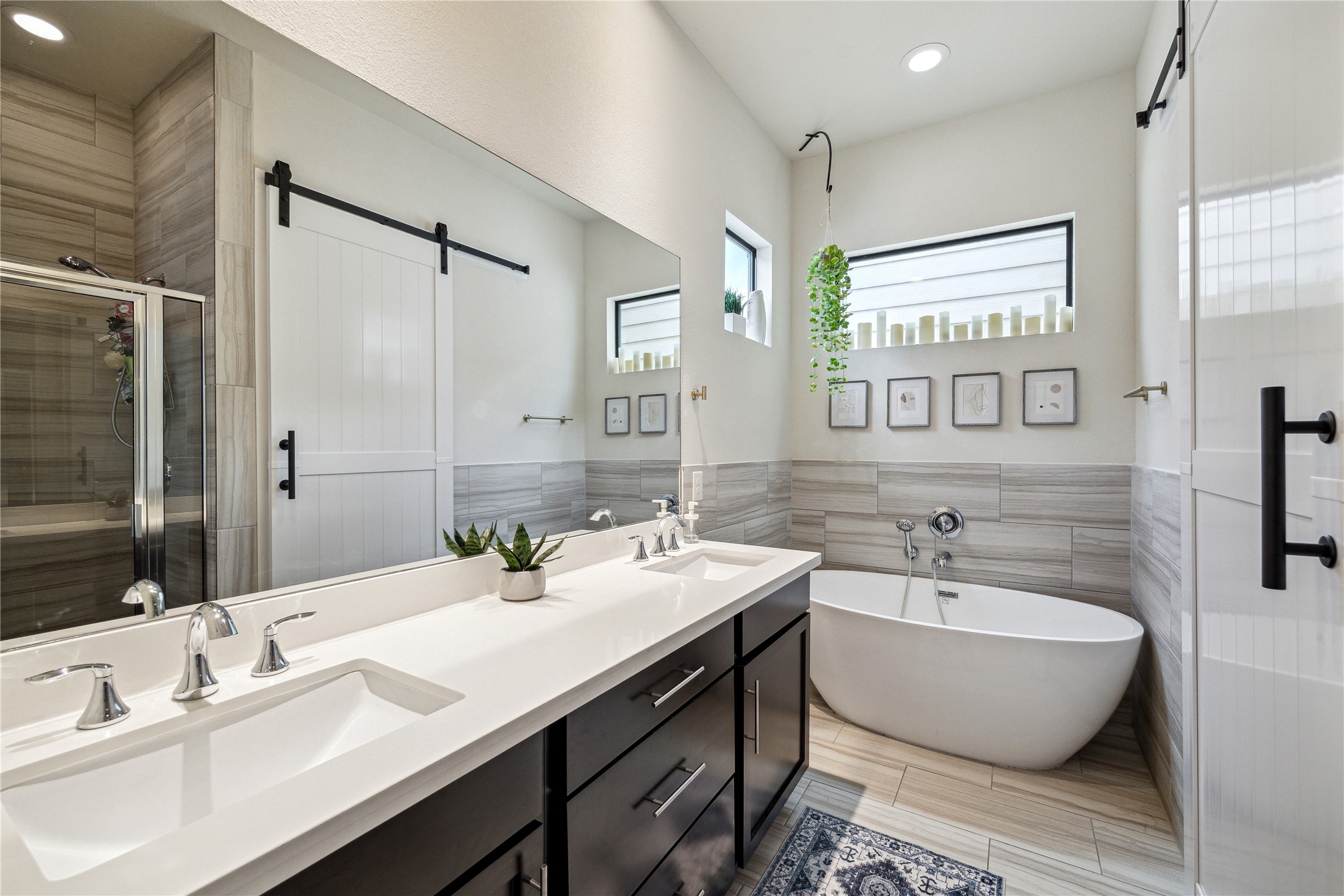 3939 Tulane Street Houston, TX 77018 - Photo 11 of 23 a bathroom with a double vanity sink a mirror and a bathtub