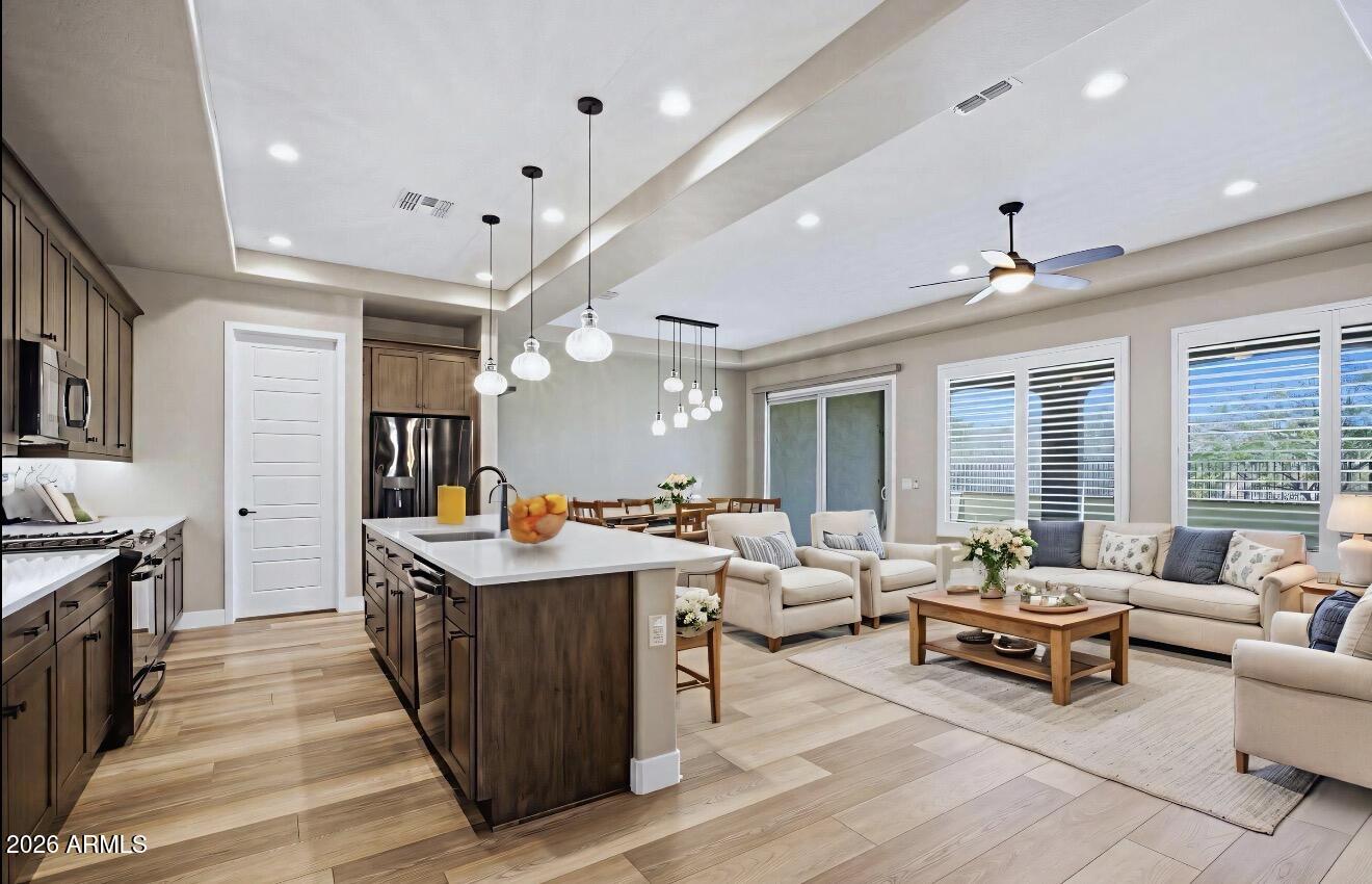 16849 West Merrell Street Goodyear, AZ 85395 - Photo 4 of 35 a living room with furniture and a large window