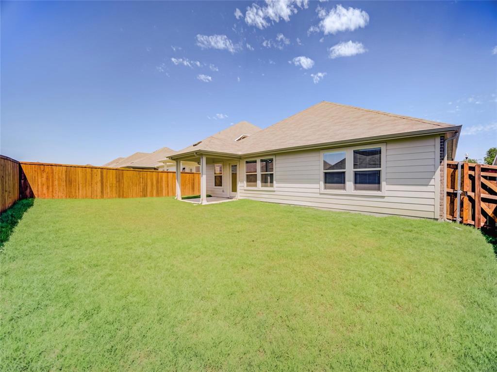 3405 Kingsgarden Road Denton, TX 76207 - Photo 29 of 37 a front view of a house with a garden