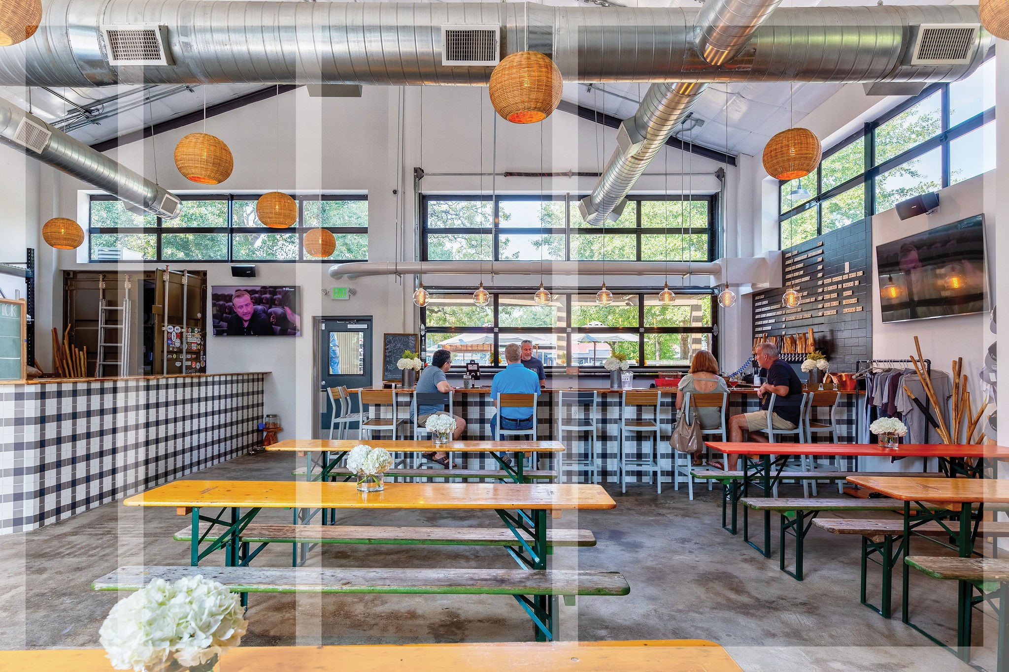 1616 Hewitt Drive Houston, TX 77018 - Photo 29 of 44 Walls of windows infuse illumination throughout the industrial interior, creating a dynamic warehouse interior that hosts the 10-barrel brewery.