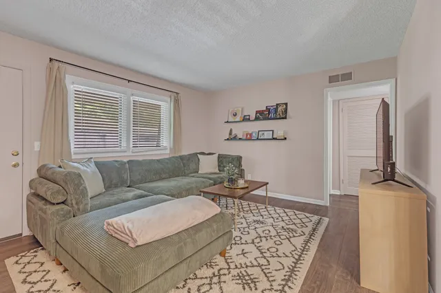 a living room with furniture and a table