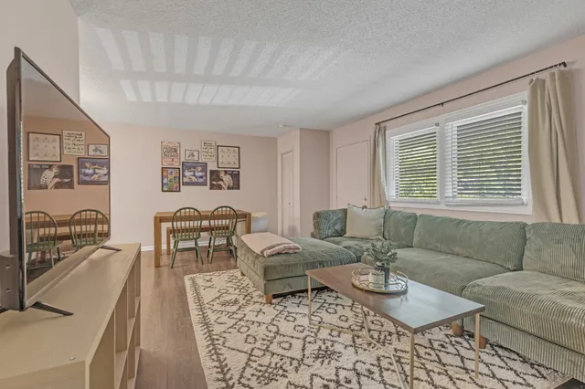 a kitchen with stainless steel appliances granite countertop a refrigerator and a stove