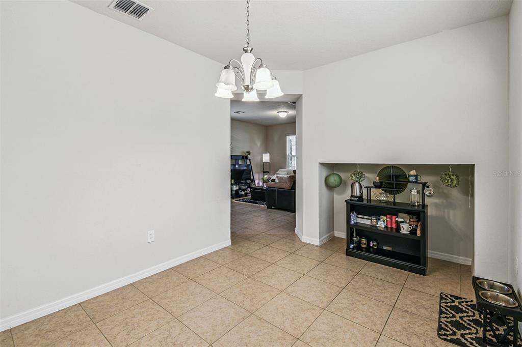 10624 Reams Road Windermere, FL 34786 - Photo 16 of 61 a living room with furniture and a fireplace