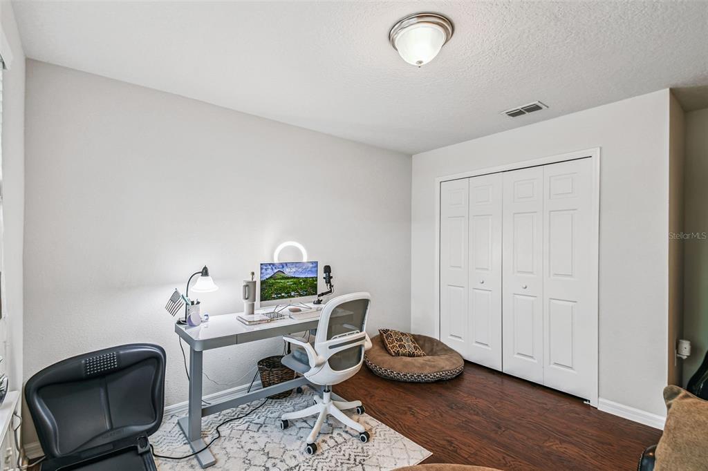 10624 Reams Road Windermere, FL 34786 - Photo 18 of 61 a workspace with furniture and wooden floor
