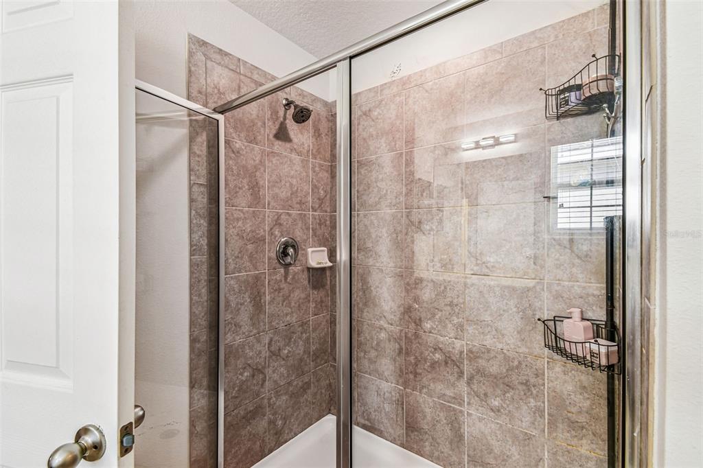 10624 Reams Road Windermere, FL 34786 - Photo 28 of 61 a bathroom with a shower