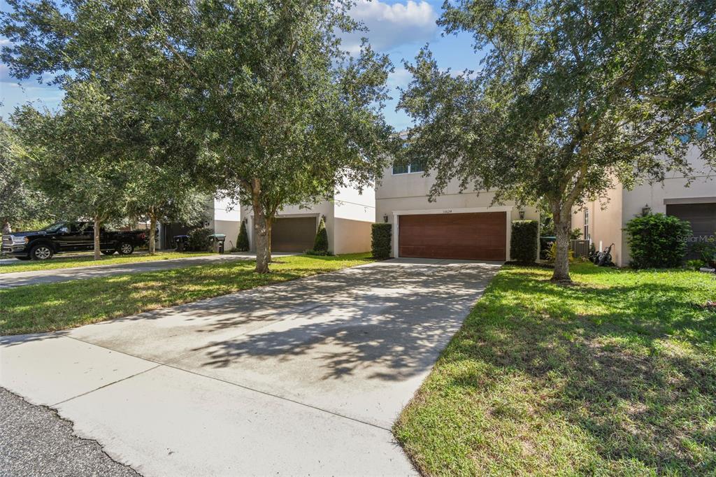 10624 Reams Road Windermere, FL 34786 - Photo 3 of 61 a view of a house with a yard and large tree