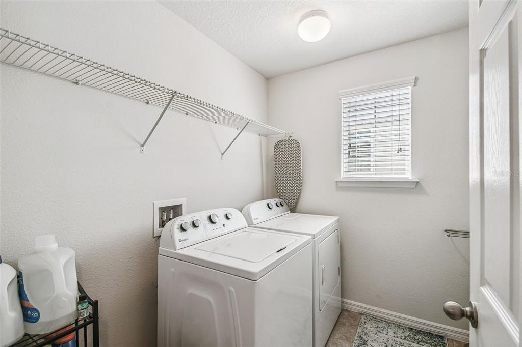 10624 Reams Road Windermere, FL 34786 - Photo 31 of 61 a utility room with dryer and washer