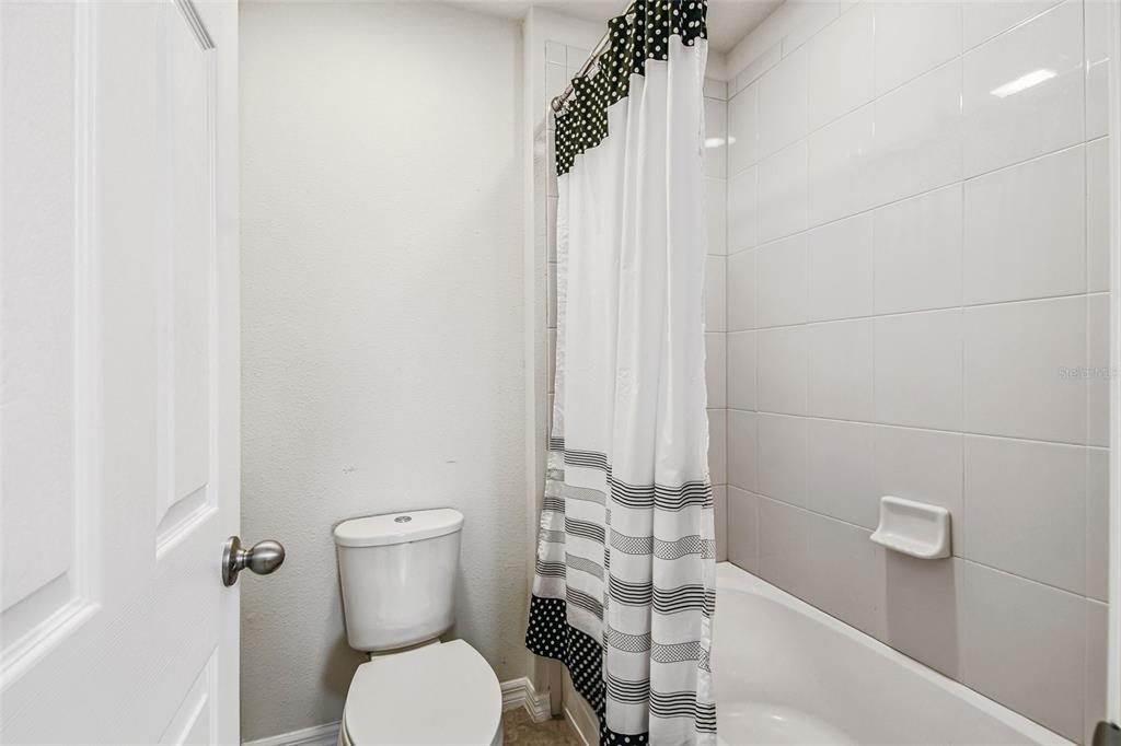10624 Reams Road Windermere, FL 34786 - Photo 33 of 61 a white toilet sitting next to a shower