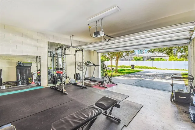 a view of a garden with a bench in the garden