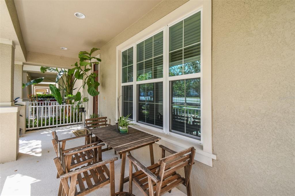 10624 Reams Road Windermere, FL 34786 - Photo 4 of 61 a balcony with table and chairs