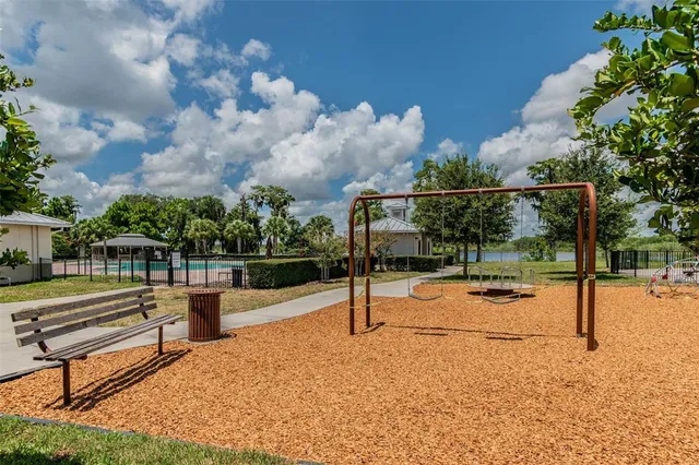 a view of a backyard with table and chairs and a yard