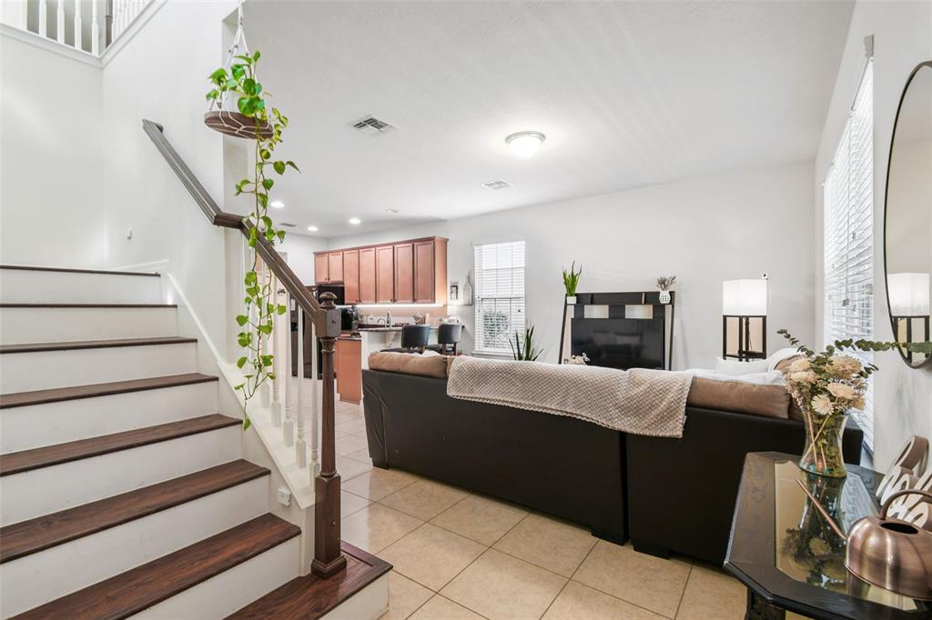 10624 Reams Road Windermere, FL 34786 - Photo 6 of 61 a living room with furniture and a fireplace