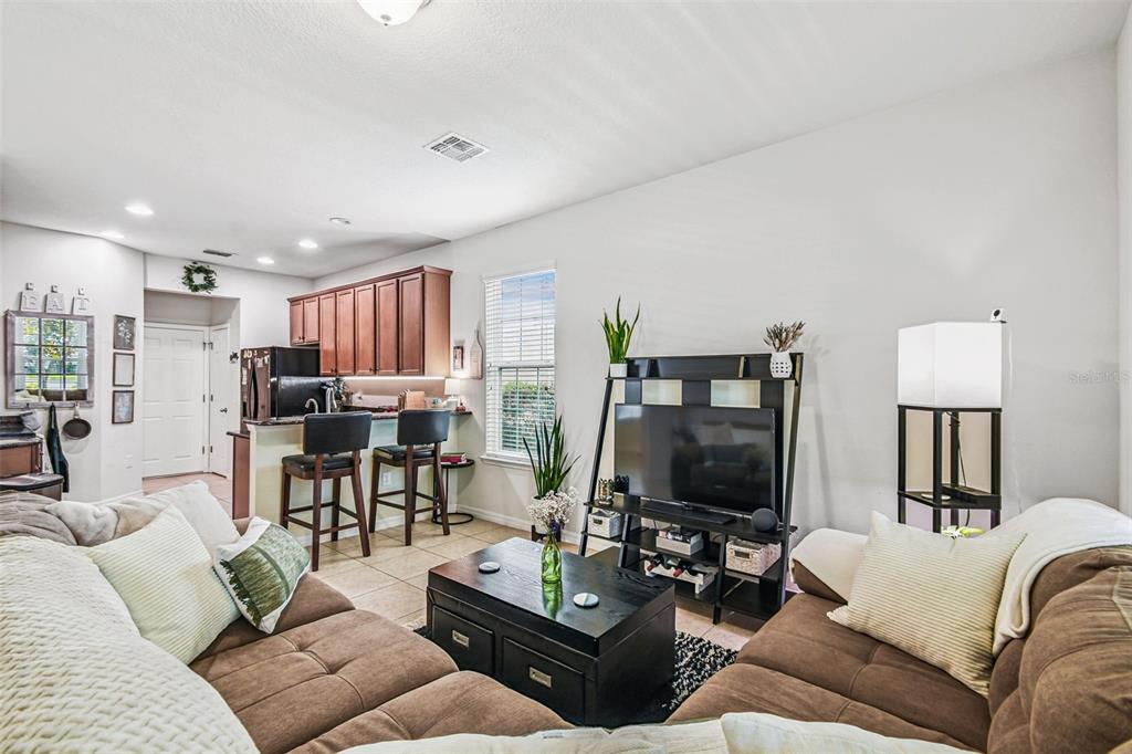 10624 Reams Road Windermere, FL 34786 - Photo 7 of 61 a living room with furniture and a flat screen tv
