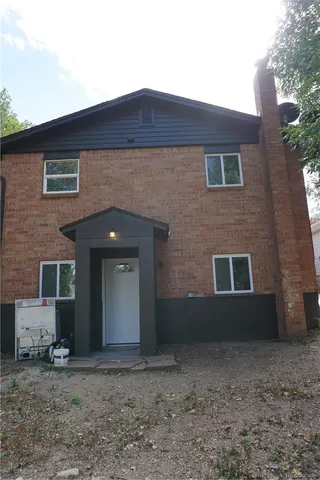 a view of a livingroom with wooden floor a flat screen tv and a window
