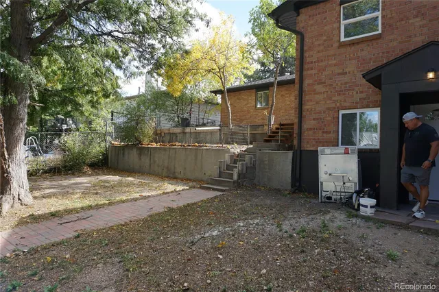a kitchen with a sink and a refrigerator
