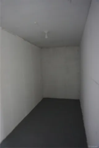 a view of a yard with plants and trees