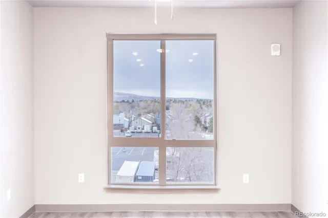 a view of a living room with a wooden floor
