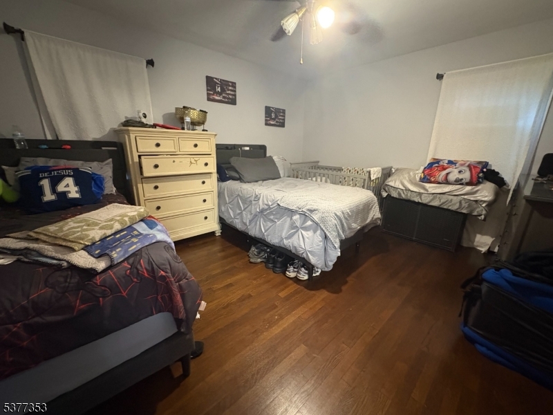 128 Grove Street, Unit 2 Bloomfield, NJ 07003 - Photo 11 of 33 a bedroom with a bed and a dresser