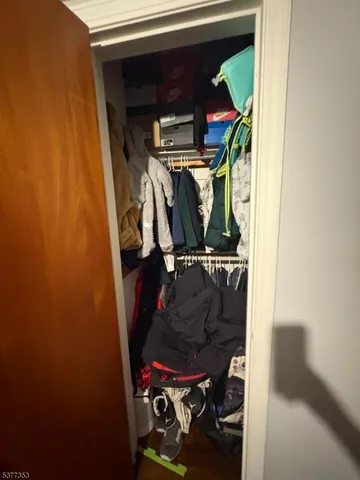 a kitchen with stainless steel appliances granite countertop a sink dishwasher and a stove with wooden cabinets