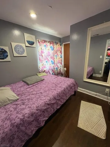 a living room with furniture a rug and a window
