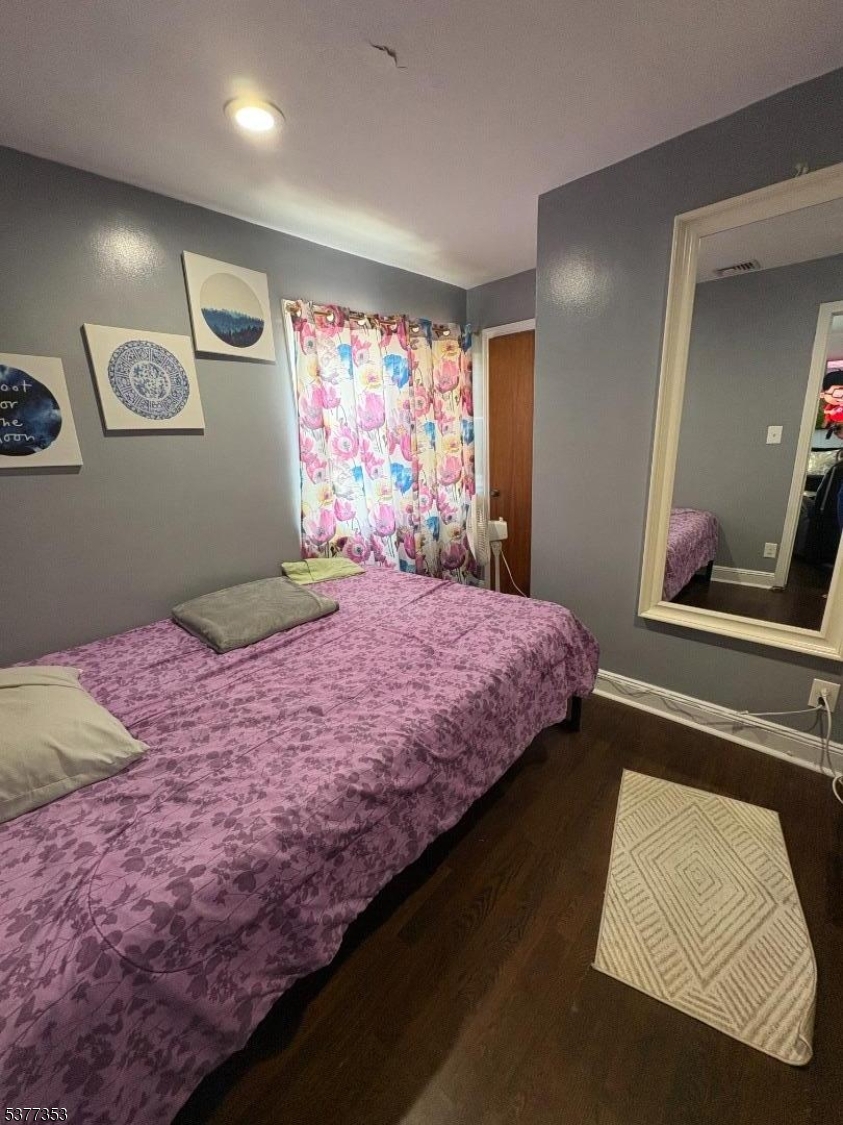 128 Grove Street, Unit 2 Bloomfield, NJ 07003 - Photo 20 of 33 a bedroom with a large bed and a large mirror