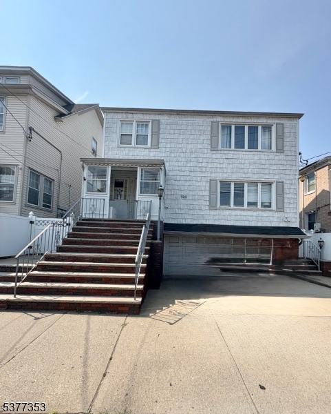 128 Grove Street, Unit 2 Bloomfield, NJ 07003 - Photo 2 of 33 a front view of a house with a yard