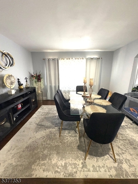 128 Grove Street, Unit 2 Bloomfield, NJ 07003 - Photo 24 of 33 a living room with furniture a rug and a window