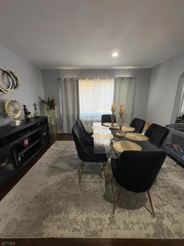 a view of a dining table and chairs in a room