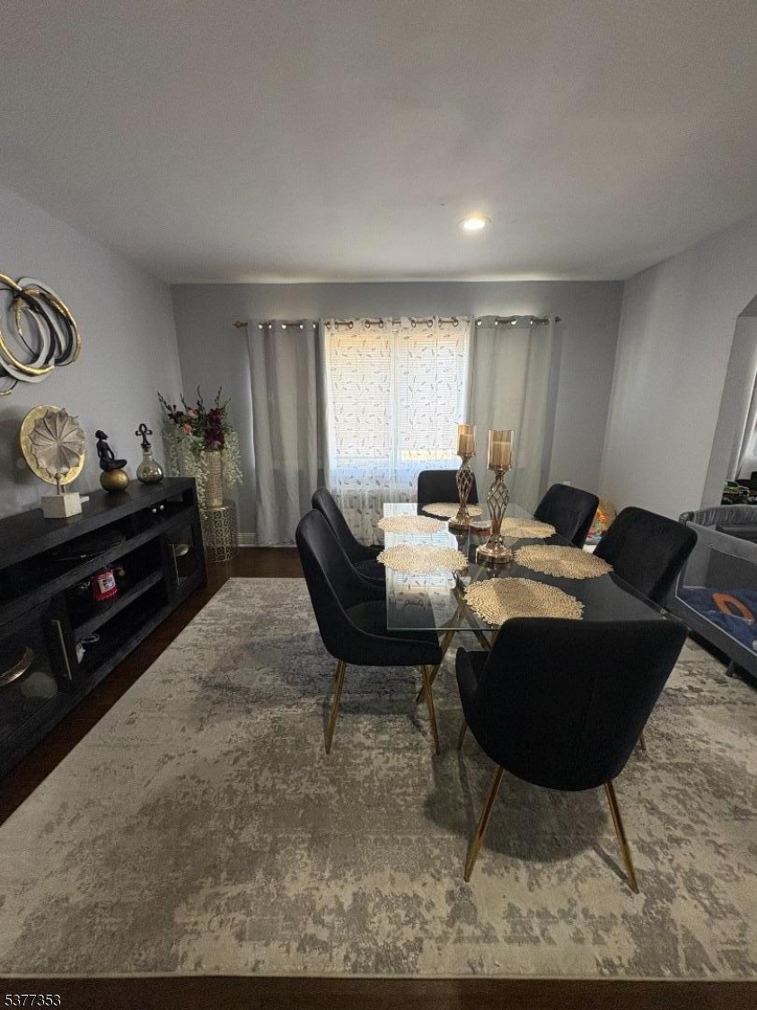 128 Grove Street, Unit 2 Bloomfield, NJ 07003 - Photo 9 of 33 a living room with furniture a rug and a window