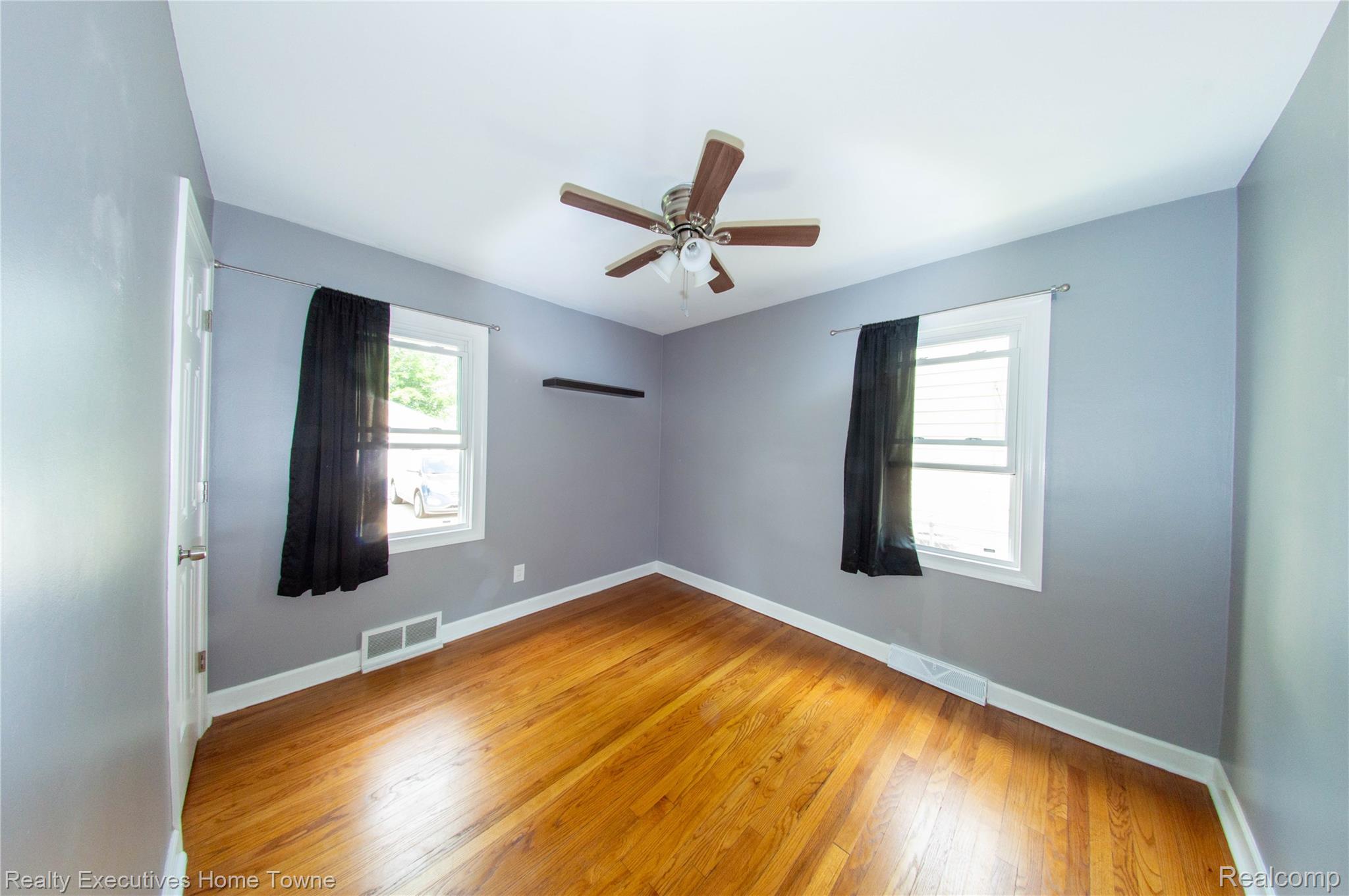 2676 Cumberland Road Berkley, MI 48072 - Photo 13 of 38 Room with wood-finish flooring, white baseboards, and light gray walls
