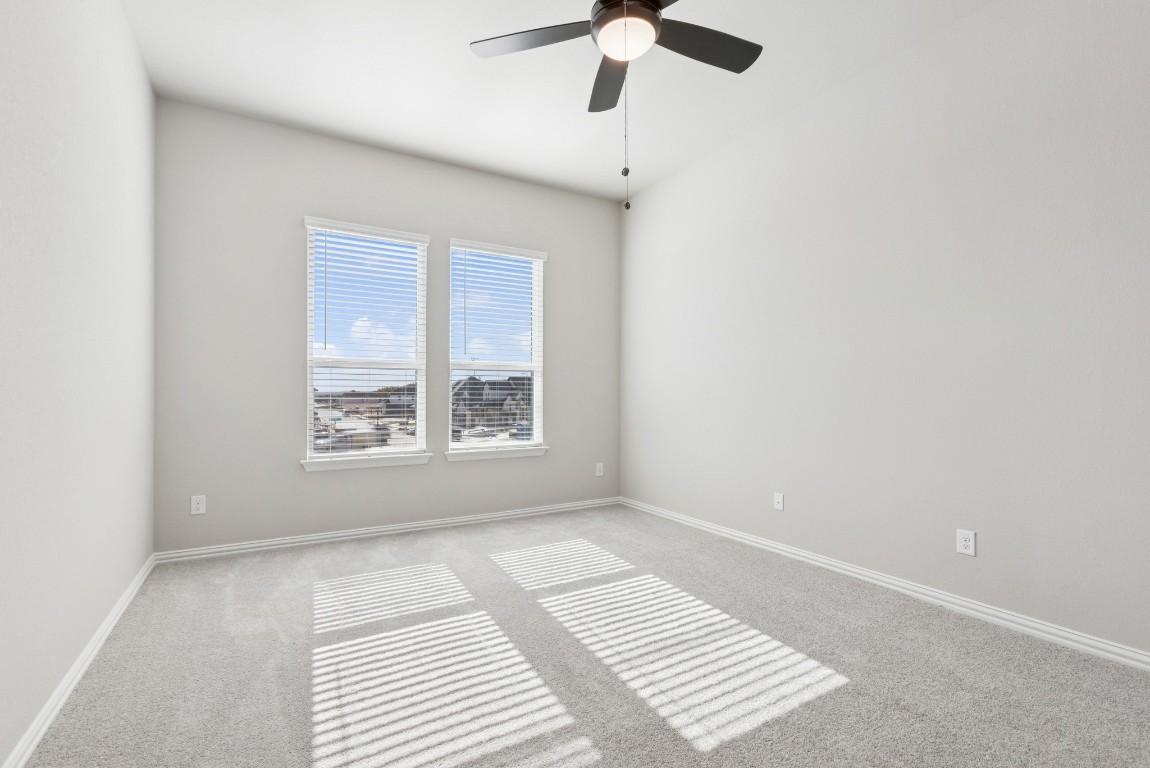 247 Grayson Elm Pass Dripping Springs, TX 78620 - Photo 11 of 39 a view of an empty room with a window