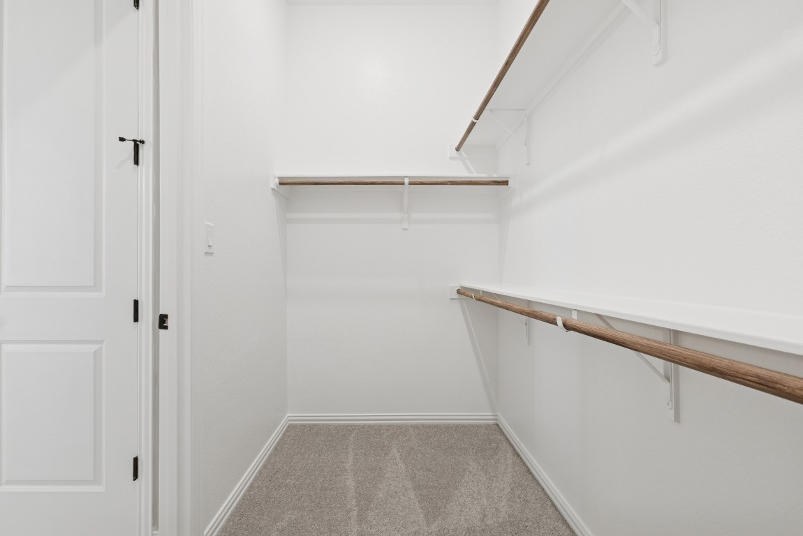247 Grayson Elm Pass Dripping Springs, TX 78620 - Photo 15 of 39 a view of an empty walk in closet