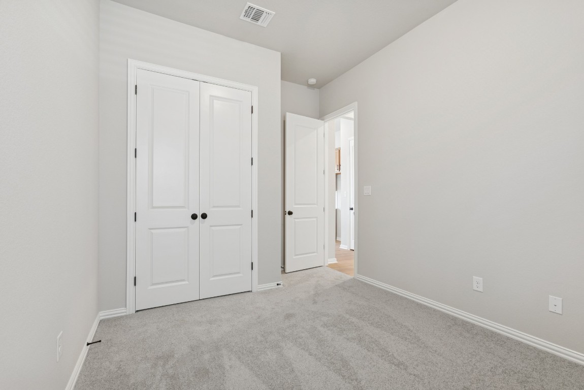 247 Grayson Elm Pass Dripping Springs, TX 78620 - Photo 17 of 39 a view of an empty room
