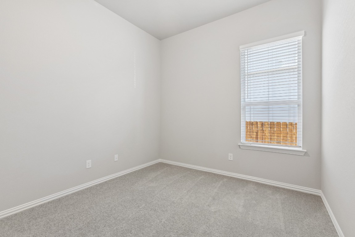 247 Grayson Elm Pass Dripping Springs, TX 78620 - Photo 18 of 39 an empty room with a window