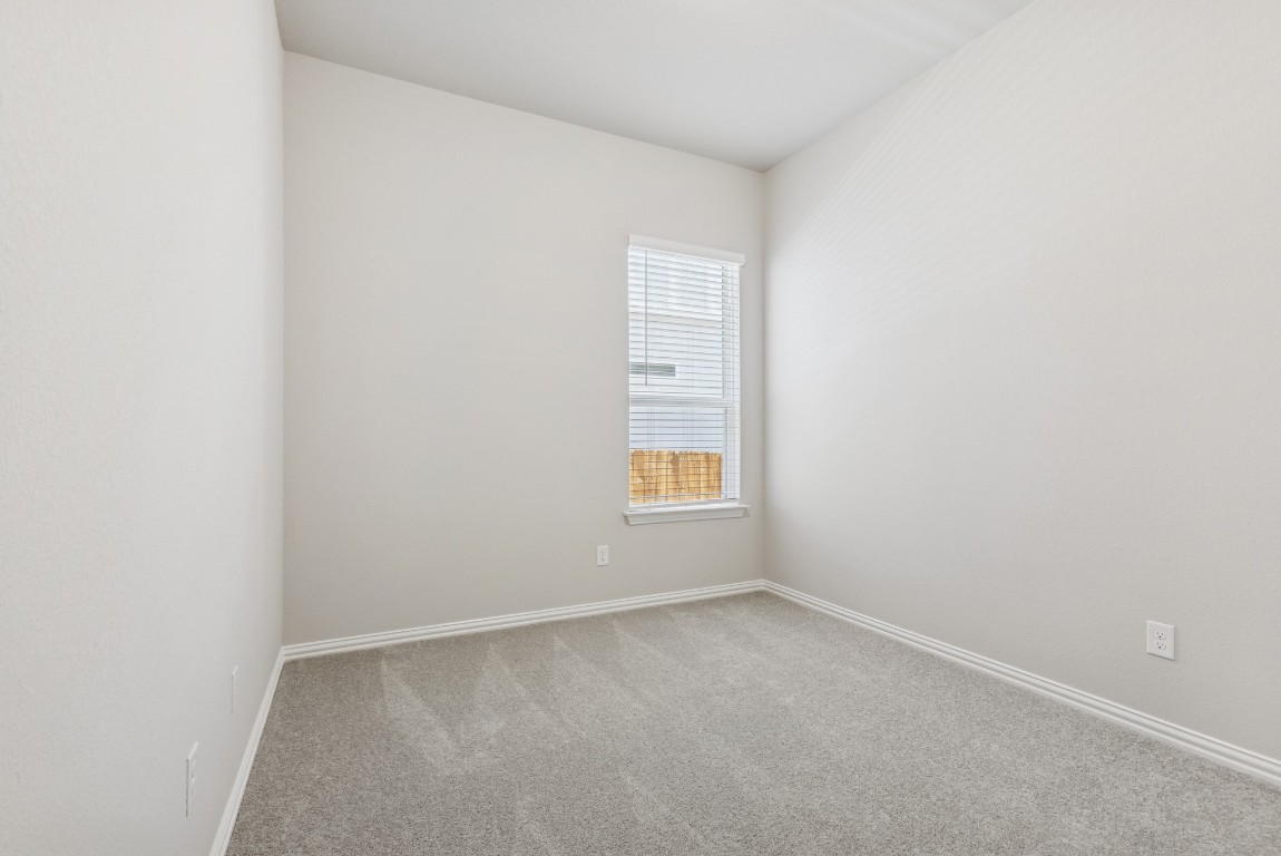 247 Grayson Elm Pass Dripping Springs, TX 78620 - Photo 20 of 39 a view of an empty room and window