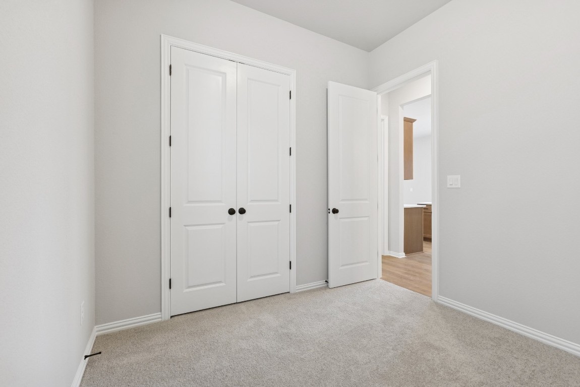 247 Grayson Elm Pass Dripping Springs, TX 78620 - Photo 21 of 39 a view of an empty room