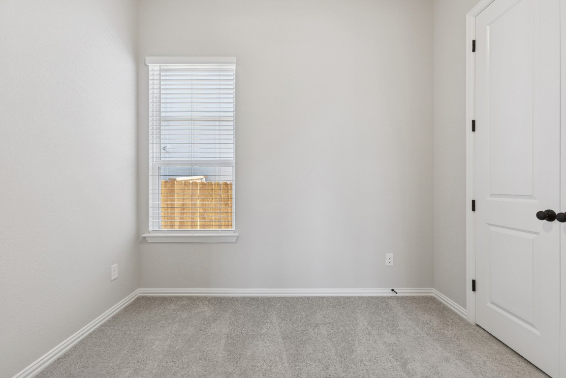 247 Grayson Elm Pass Dripping Springs, TX 78620 - Photo 23 of 39 an empty room with a window